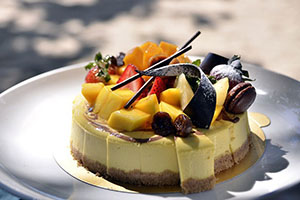cheese cake with fruit and chocolate top